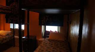 Отель Титул Нижний Новгород Односпальная кровать в общем номере с 4 кроватями-2